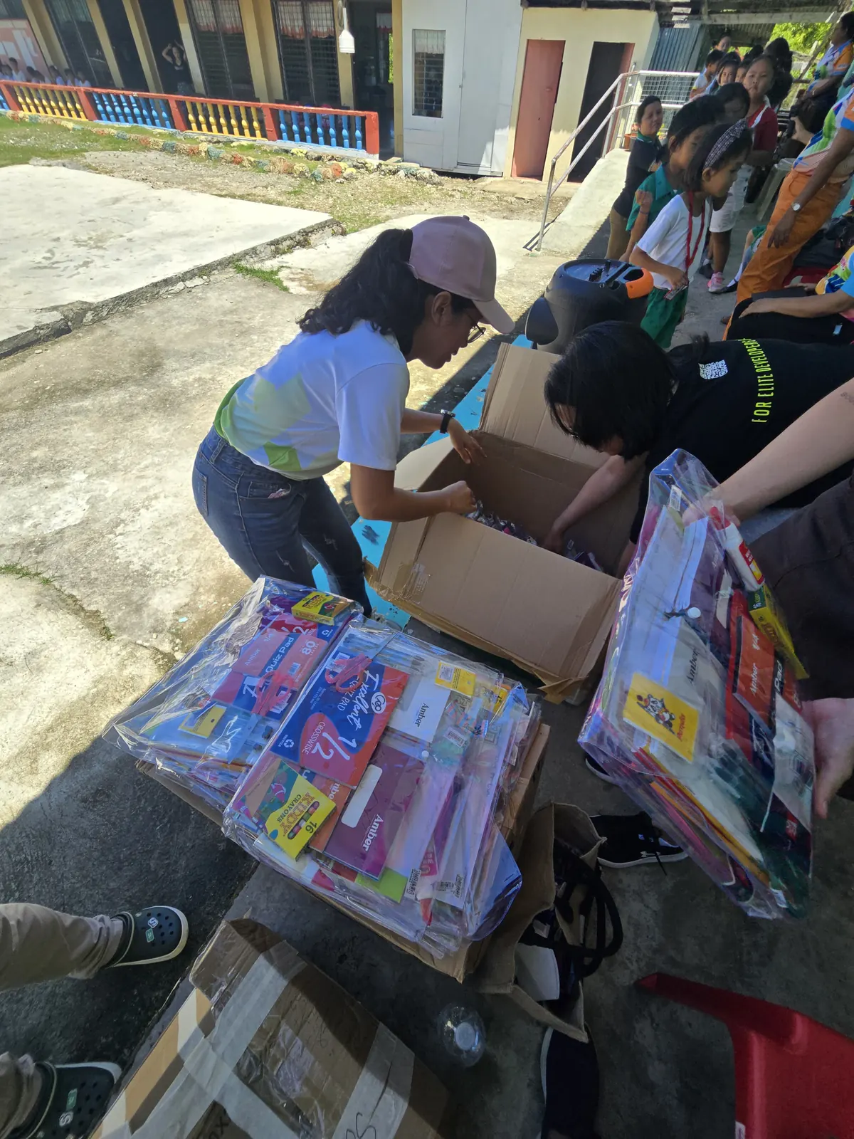 Boxes of school supplies being unpacked for children of fisherfolk families on Cabilao Island