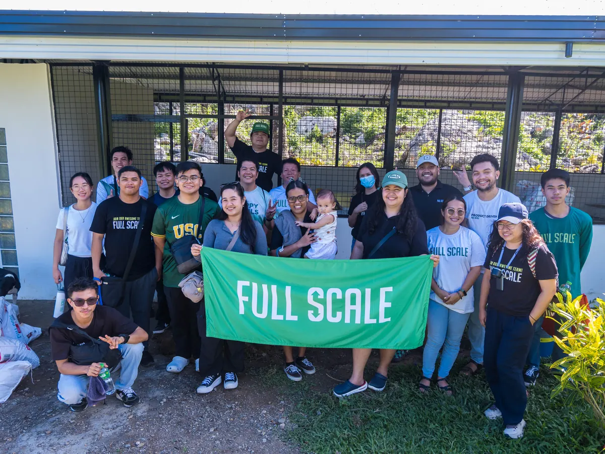 Volunteers and shelter staff with rescued dogs at Island Rescue Organization